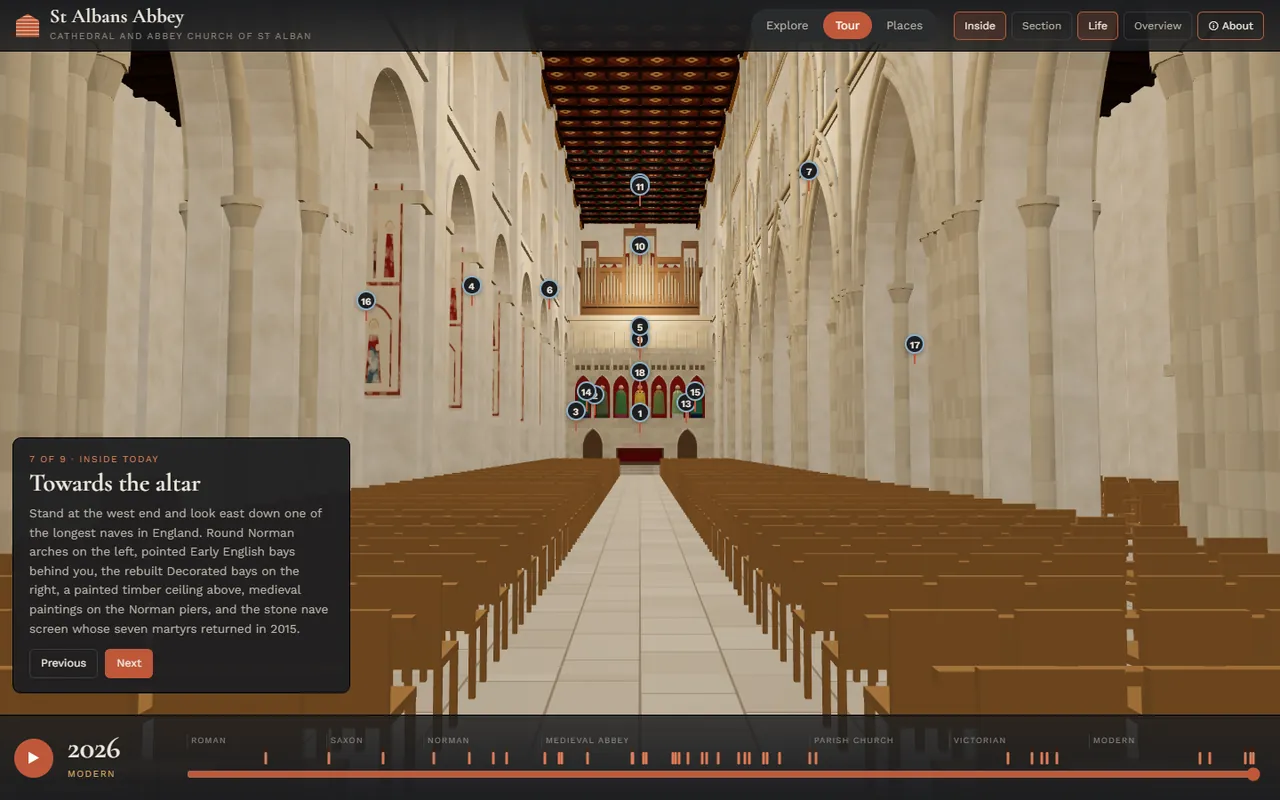 Inside the cathedral: standing at the west end of the nave looking east, with the arcades, the painted timber ceiling, pews and the nave screen, and the tour card on the left
